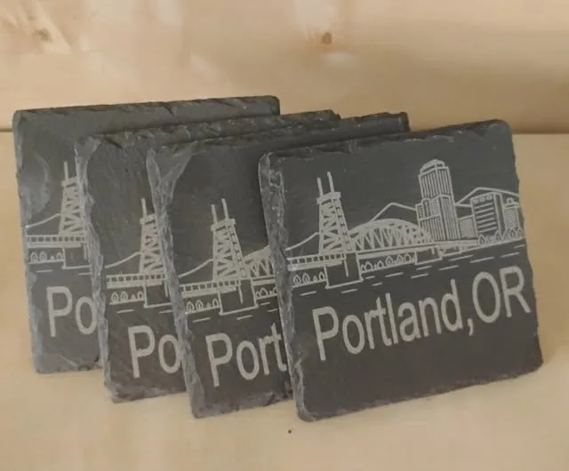 4 coasters with portland or and city line